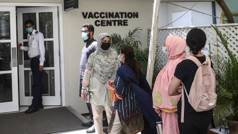 People wait to receive a dose of Russia's Sputnik V vaccine in Karachi, Pakistan, on April 5.