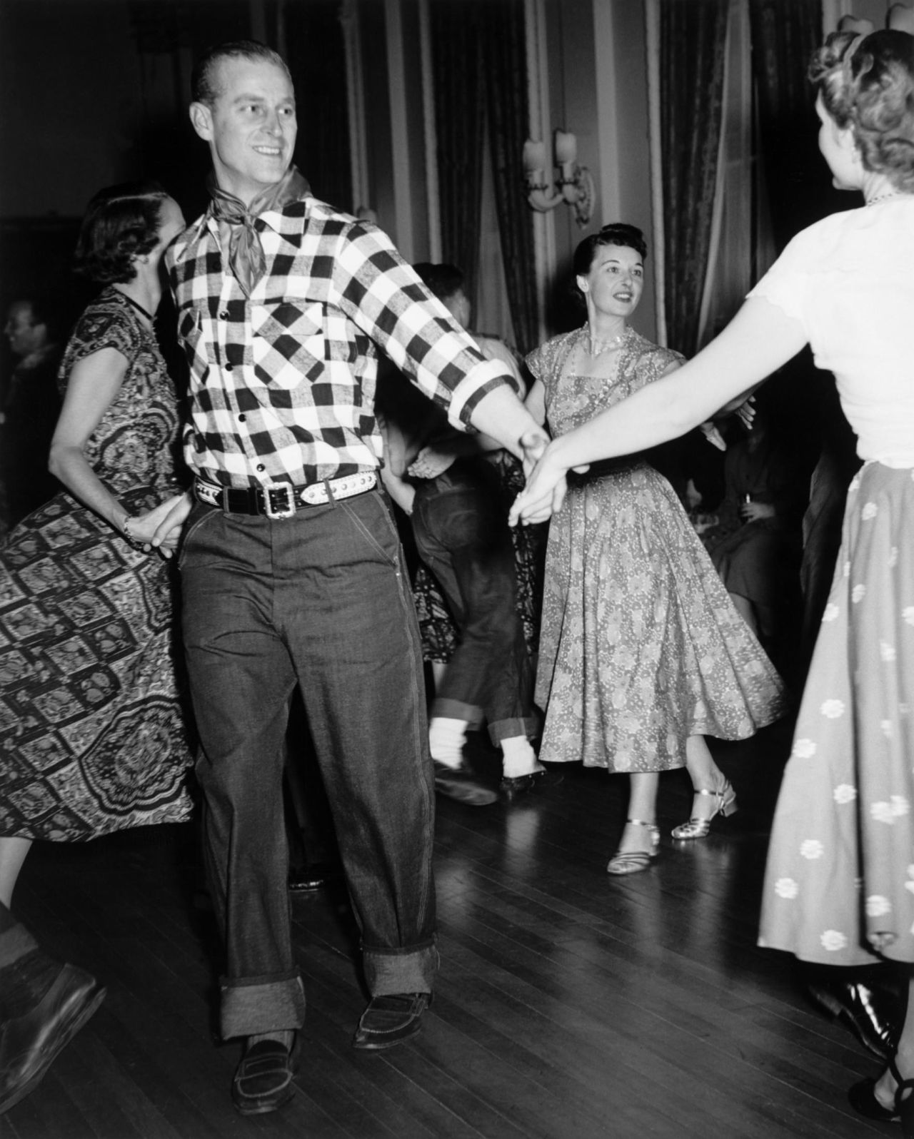 Prince Philip is pictured dancing at a traditional hoedown held in the honour of the Royal Couple at Rideau Hall, Ottawa, during a five-week visit of Canada in 1951. 
