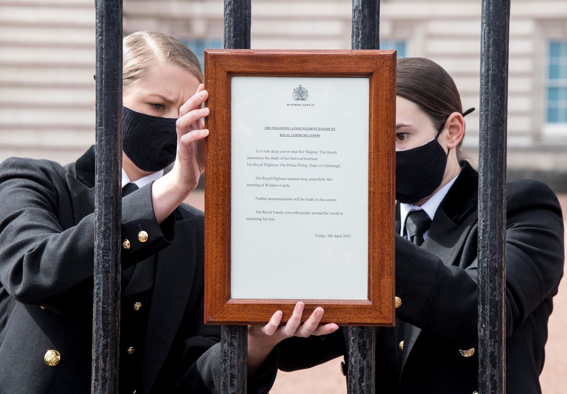 A sign announcing the death of Prince Philip is placed on the gates of Buckingham Palace in London. 