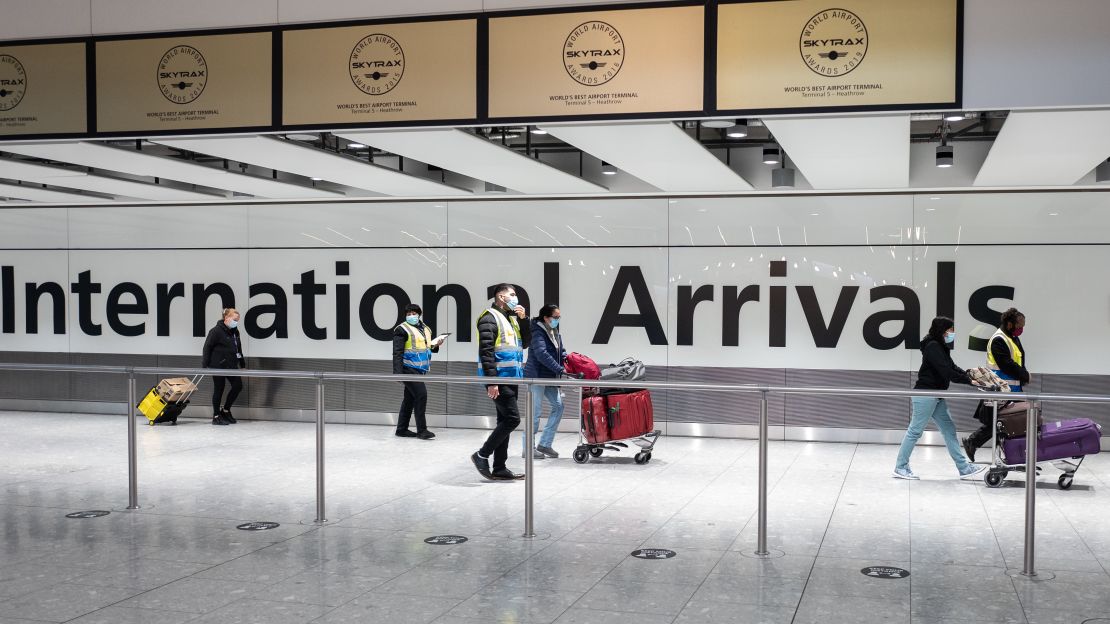 Passengers arriving from a "red list" destination in Terminal 5 of Heathrow airport in February 2021.