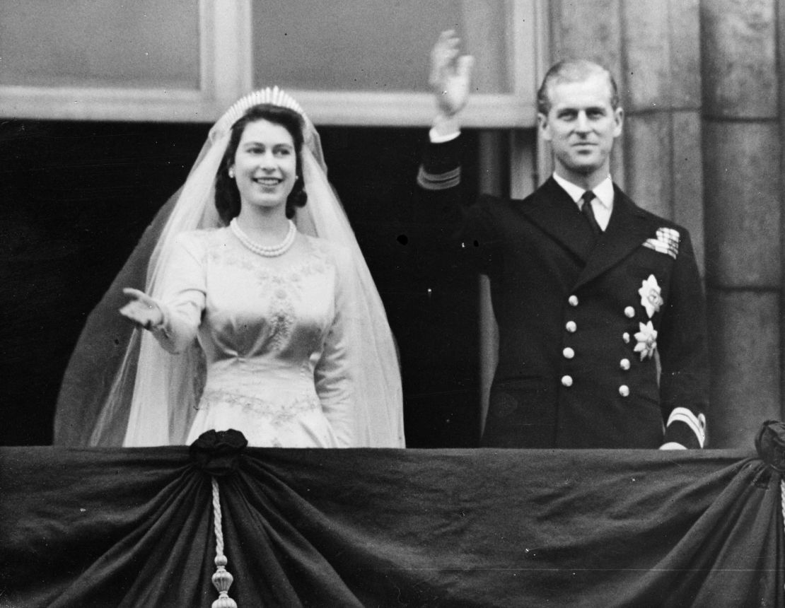 Princess Elizabeth and Prince Philip wave to the crowd from a balcony of Buckingham Palace shortly after their wedding at London's Westminster Abbey in 1947.