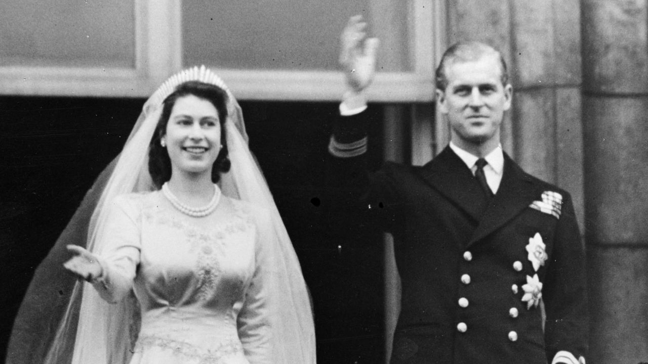 Princess Elizabeth and Prince Philip wave to the crowd from a balcony of Buckingham Palace shortly after their wedding at London's Westminster Abbey in 1947.