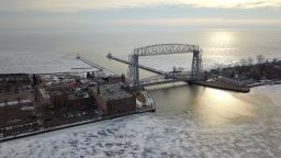 Lake Superior contains roughly 10 percent of world's accessible drinking water and is the largest of the Great Lakes. The Aerial Lift Bridge raises for ships entering the harbor from Lake Superior.