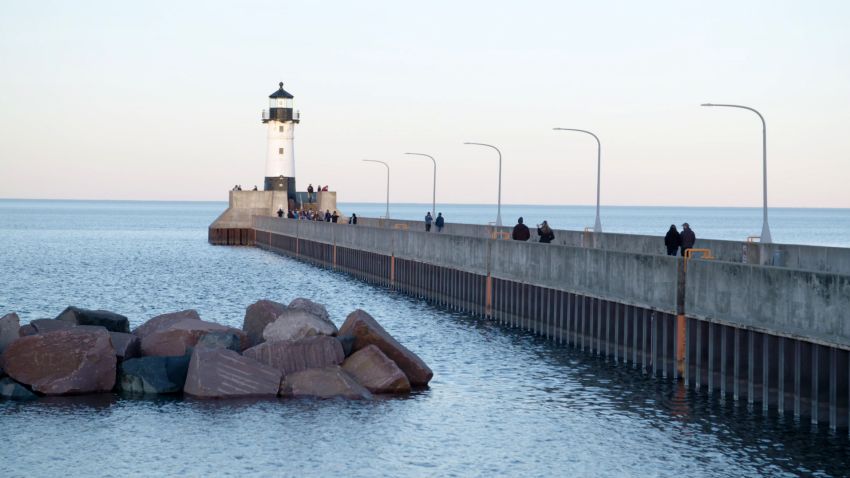 The light house along Canal Park, a popular tourist destination, guides ships into the harbor
