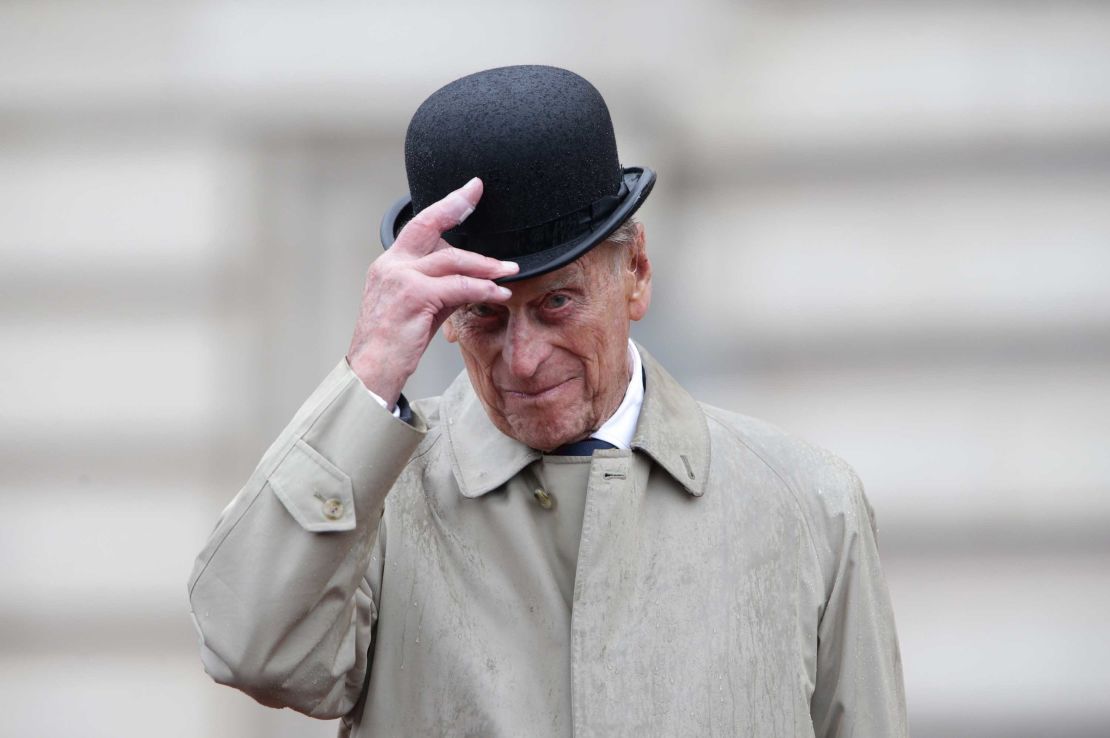 Prince Philip raises his hat in his role as Captain General Royal Marines, as he attends a parade on the Buckingham Palace forecourt in August 2017.