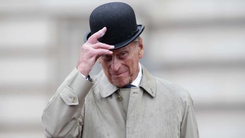 Prince Philip raises his hat in his role as Captain General Royal Marines, as he attends a parade on the Buckingham Palace forecourt in August 2017.