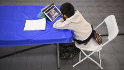 A child attends an online class at a learning hub inside the Crenshaw Family YMCA in Los Angeles, February 17.