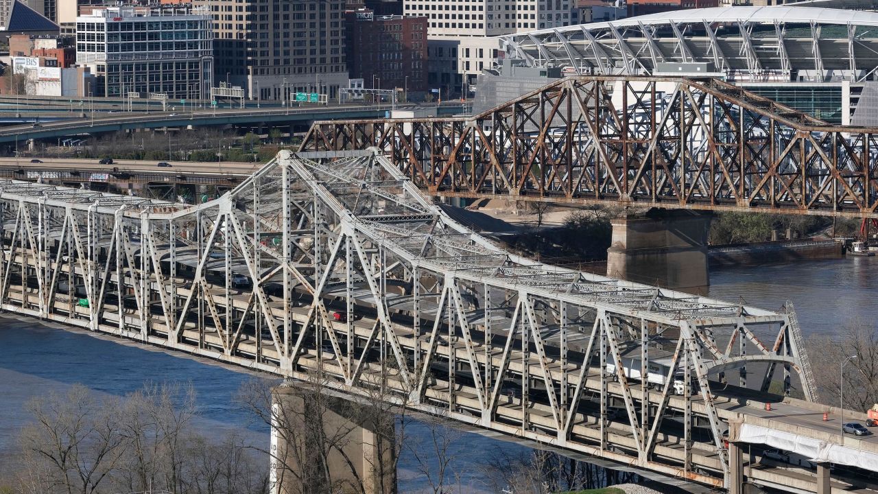 The Brent Spence Bridge spans the Ohio River on the Ohio-Kentucky border in Cincinnati, Ohio on April 2, 2021. - US President Biden has announced an ambitious $2 trillion infrastructure plan that would pump huge sums of money into improving the nations bridges, roads, public transportation, railways, ports and airports. The Brent Spence Bridge, which connects Covington to Cincinnati via Interstates 71 and 75,  is considered to be "functionally obsolete" due to the amount of daily traffic it carries, which is nearly double for its original design.