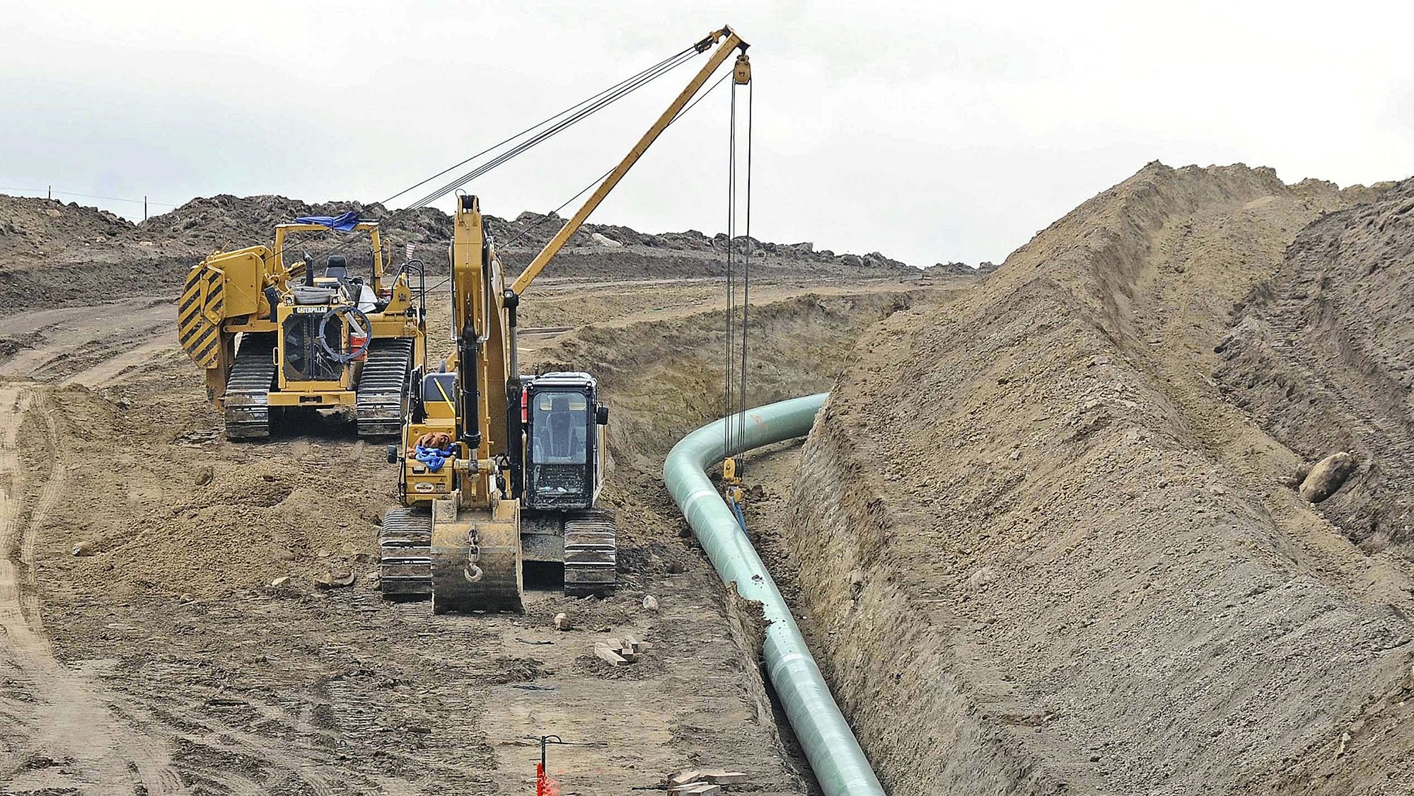 FILE - In this Oct. 5, 2016, file photo, heavy equipment is seen at a site where sections of the Dakota Access pipeline were being buried near the town of St. Anthony in Morton County, N.D. Native American tribes opposed to the Dakota Access Pipeline once again have asked a federal judge to stop the flow of oil while the legal battle over the line's future plays out. (Tom Stromme/The Bismarck Tribune via AP, File)