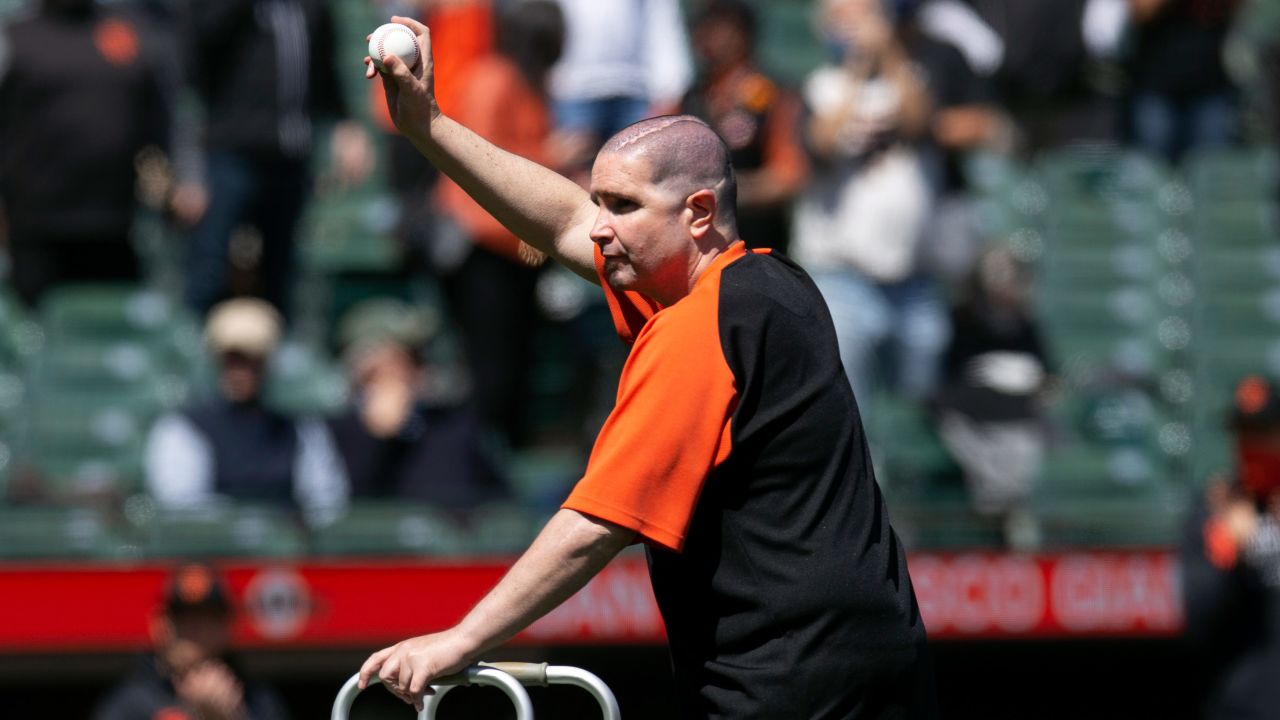San Francisco Giants fan Bryan Stow, who was attacked following a game in Los Angeles 10 years ago, throws out the first pitch before a Major League Baseball game.