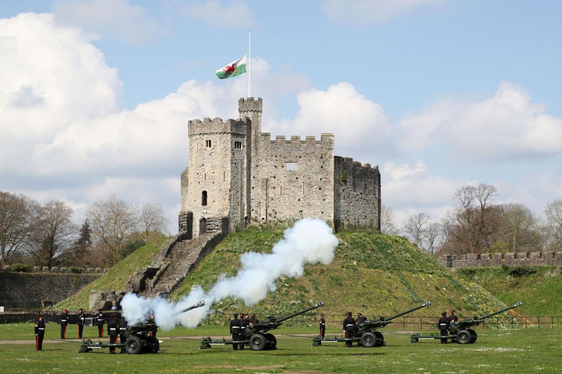 The gun salute is fired by the 104th Regiment Royal Artillery to mark the passing of Philip, the Duke of Edinburgh, at Cardiff Castle, in Wales on Saturday.