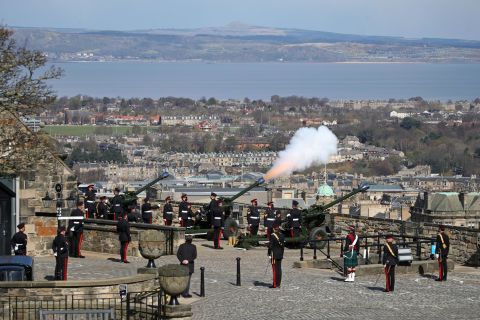 Members of the 105th Regiment Royal Artillery fire a 41-round gun salute at Edinburgh Castle in Scotland.