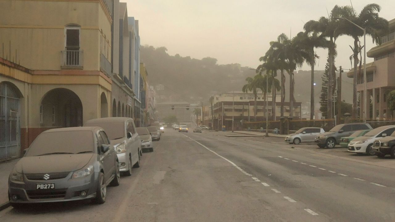 Ash covers roads a day after La Soufrière volcano erupted earlier this month in St. Vincent and the Grenadines. 