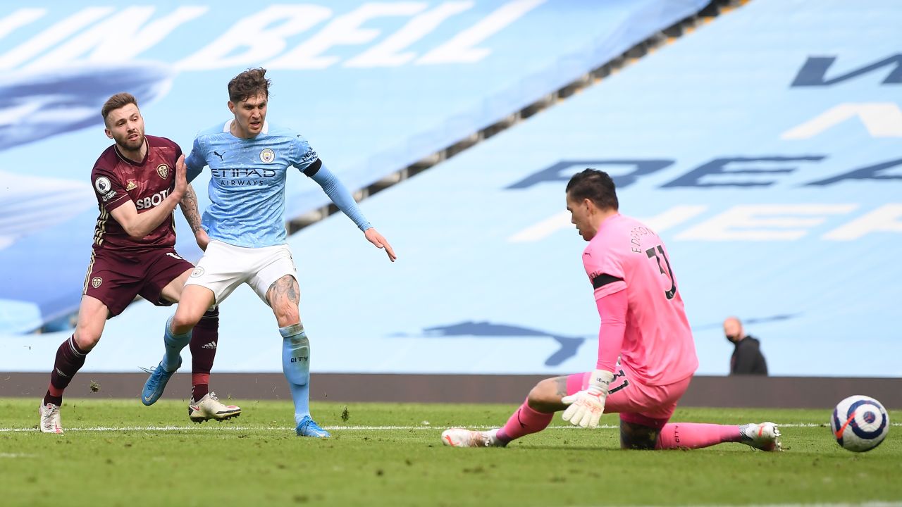 Dallas (left) scores the winner past Ederson.