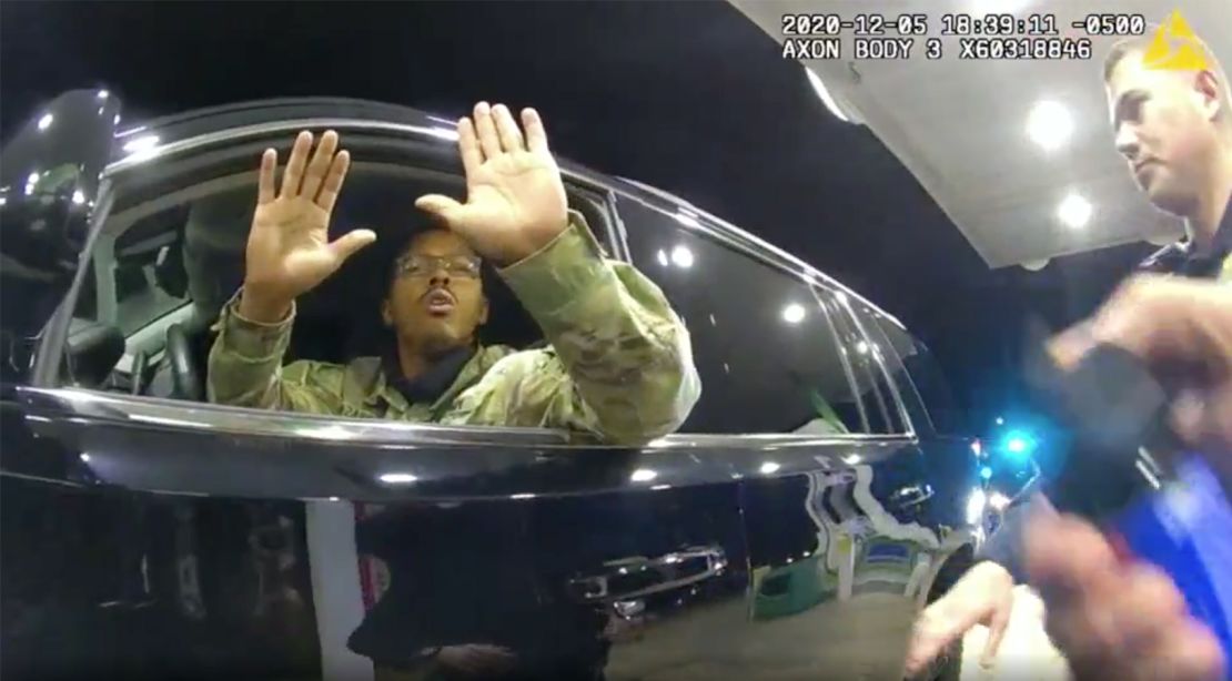Caron Nazario is seen in this still image from body camera footage holding his hands up before a police officer pepper sprays him.
