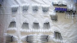 LOS ANGELES, CALIFORNIA - APRIL 09: Syringes are prepared for doses of the Pfizer COVID-19 vaccine at a clinic targeting minority community members at St. Patrick's Catholic Church on April 9, 2021 in Los Angeles, California. St. John's Well Child and Family Center is administering COVID-19 vaccines  in churches across South L.A. in a broad effort to bring vaccines to minority  communities.  (Photo by Mario Tama/Getty Images)
