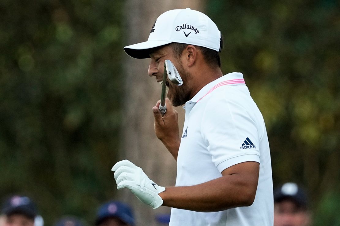 Schauffele bites his club after taking his second tee shot on the 16th hole during the final round of the Masters.
