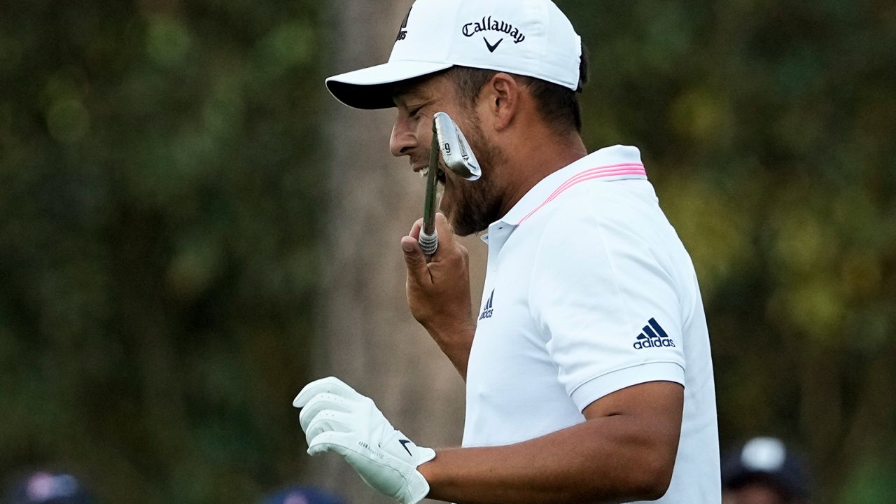 Schauffele bites his club after taking his second tee shot on the 16th hole during the final round of the Masters.