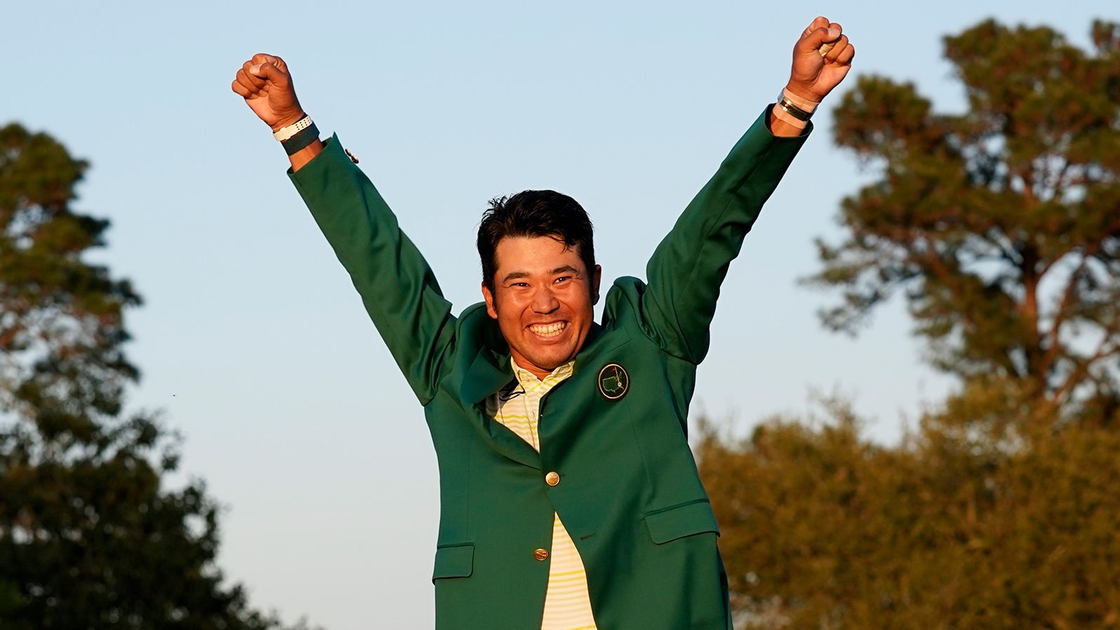 Hideki Matsuyama celebrates with the green jacket after winning the Masters golf tournament on Sunday, April 11. He finished one shot ahead of Will Zalatoris.