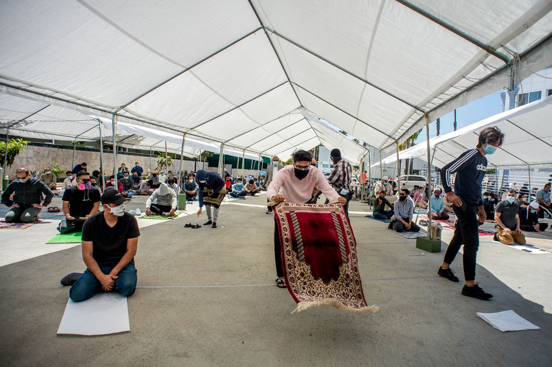 Men attend socially distanced outdoor prayers in Culver City, California.