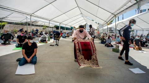 Men attend socially distanced outdoor prayers in Culver City, California.