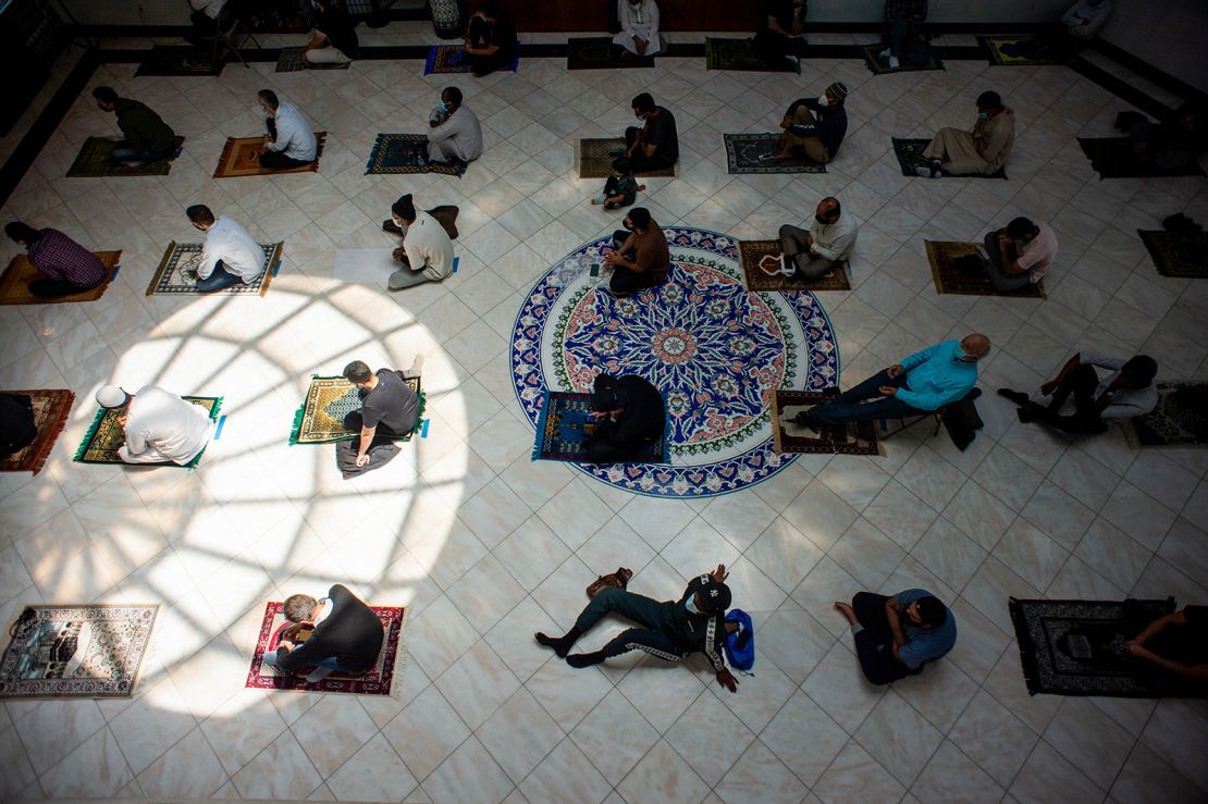 Men space out their prayer rugs during prayers at King Fahad Mosque in Culver City, California.