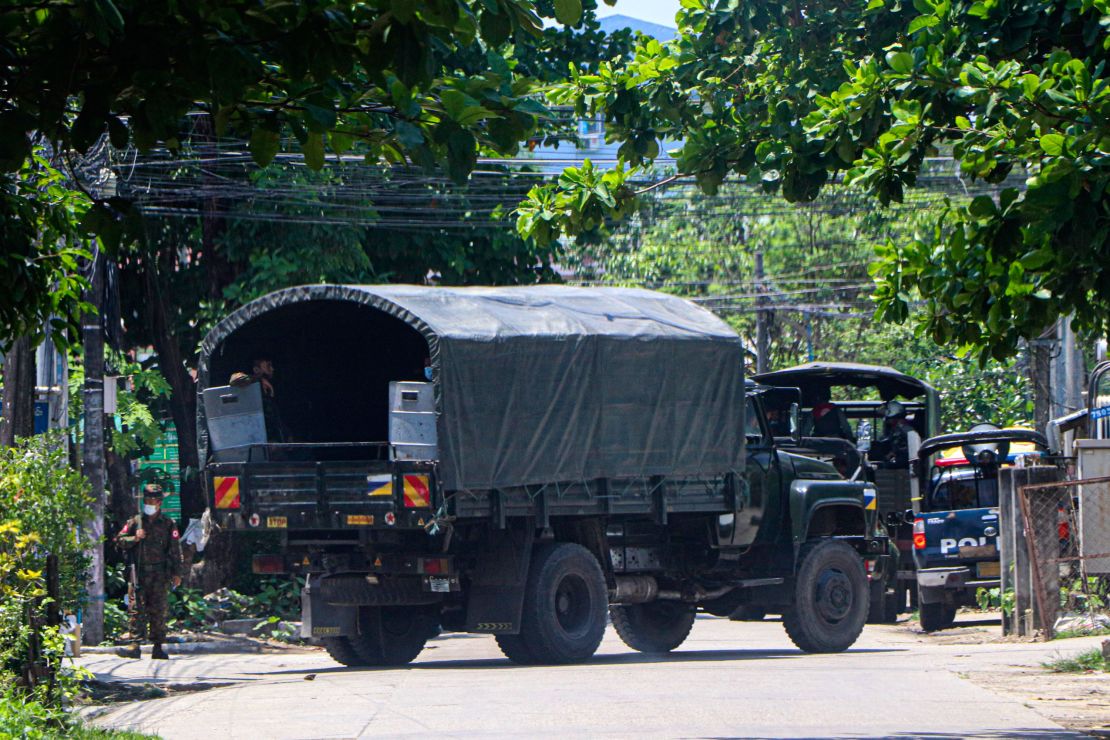A police vehicle is parked at a road in South Okkalapa township to block anti-coup protesters' gathering in Yangon, Myanmar, Friday, April 9, 2021. 
