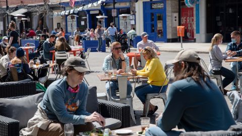 People dine outdoors at a restaurant in Ann Arbor, Michigan, on April 4.