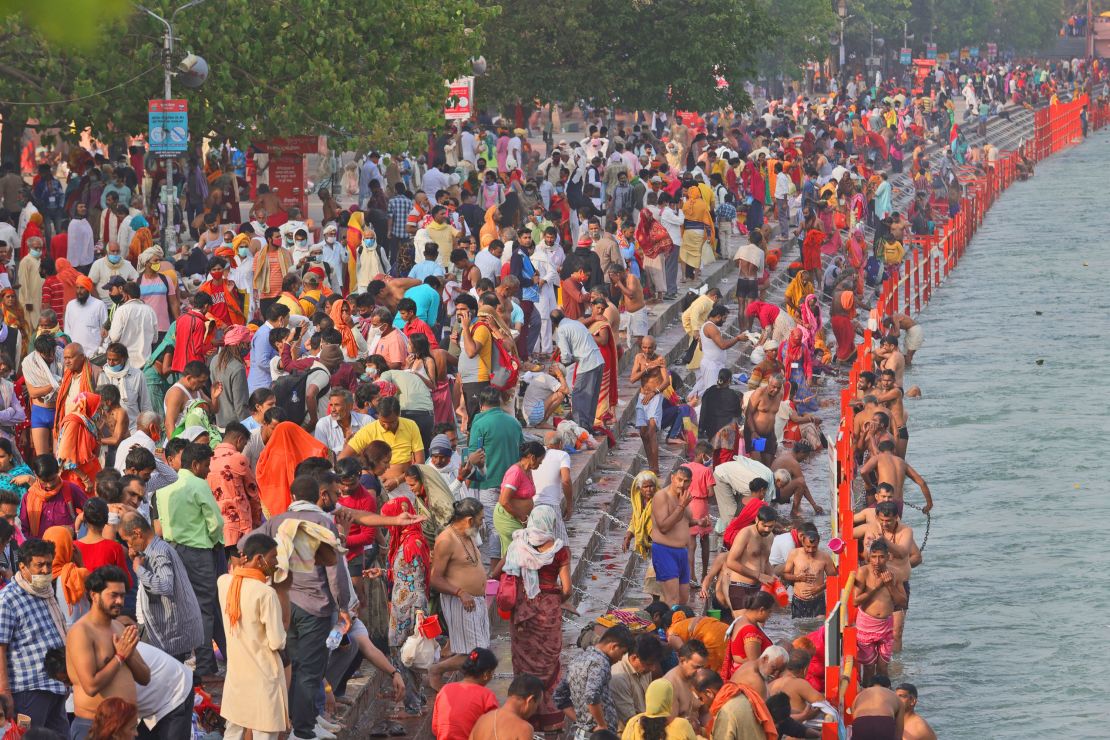 Hindu devotees take holy dips in the Ganges river in Haridwar during this year's Kumbh Mela