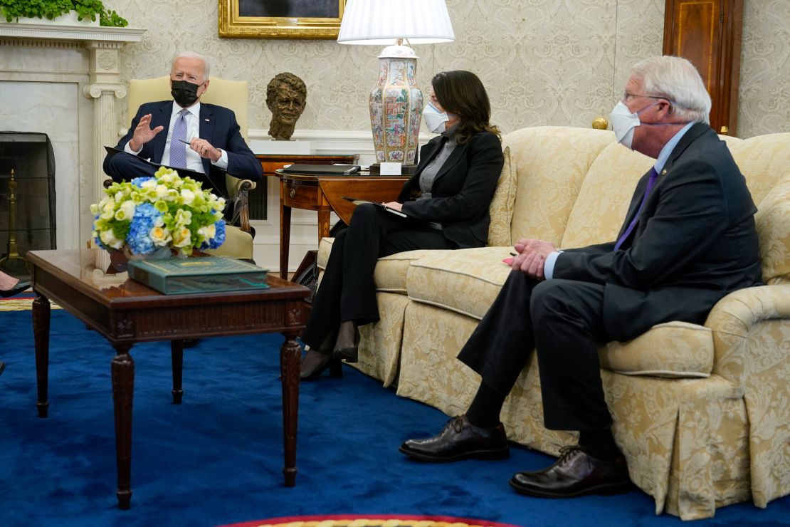 President Joe Biden speaks during a meeting with lawmakers in the Oval Office of the White House on Monday. Seated alongside Biden are Sen. Maria Cantwell, of Washington, and Sen. Roger Wicker of Mississippi. 