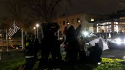 Demonstrators shout "Don't shoot" at the police after curfew as they protest the death of Daunte Wright who was shot and killed by a police officer in Brooklyn Center, Minnesota on April 12, 2021. - A suburb of Minneapolis was under curfew early April 12, 2021 after US police fatally shot a young Black man, sparking protests not far from where a former police officer was on trial for the murder of George Floyd.Hundreds of people gathered outside the police station in Brooklyn Center, northwest of Minneapolis, with police later firing teargas and flash bangs to disperse the crowd, according to an AFP videojournalist. (Photo by Kerem Yucel / AFP) (Photo by KEREM YUCEL/AFP via Getty Images)
