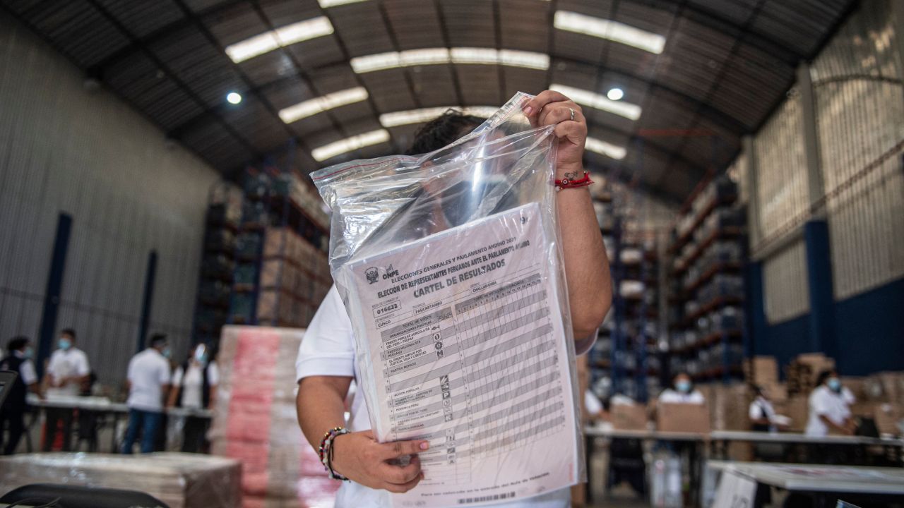 Workers prepare electoral material in Lima on March 26, 2021, ahead of Peru's presidential and general elections on April 11. 