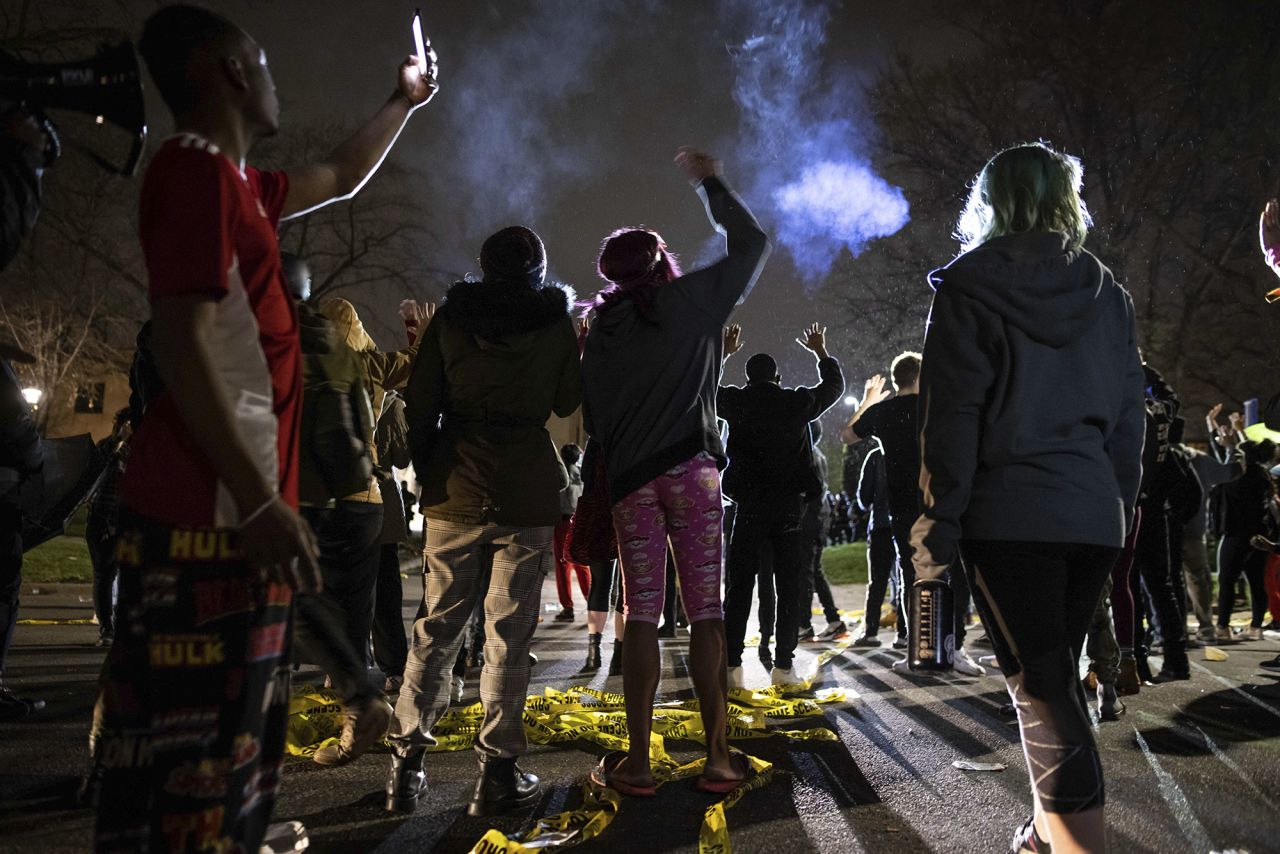 Protesters gather in front of the Brooklyn Center police station on Sunday.