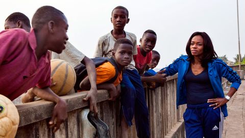 Isha Johansen speaking to a group of boys outside the National Stadium, in 2016.