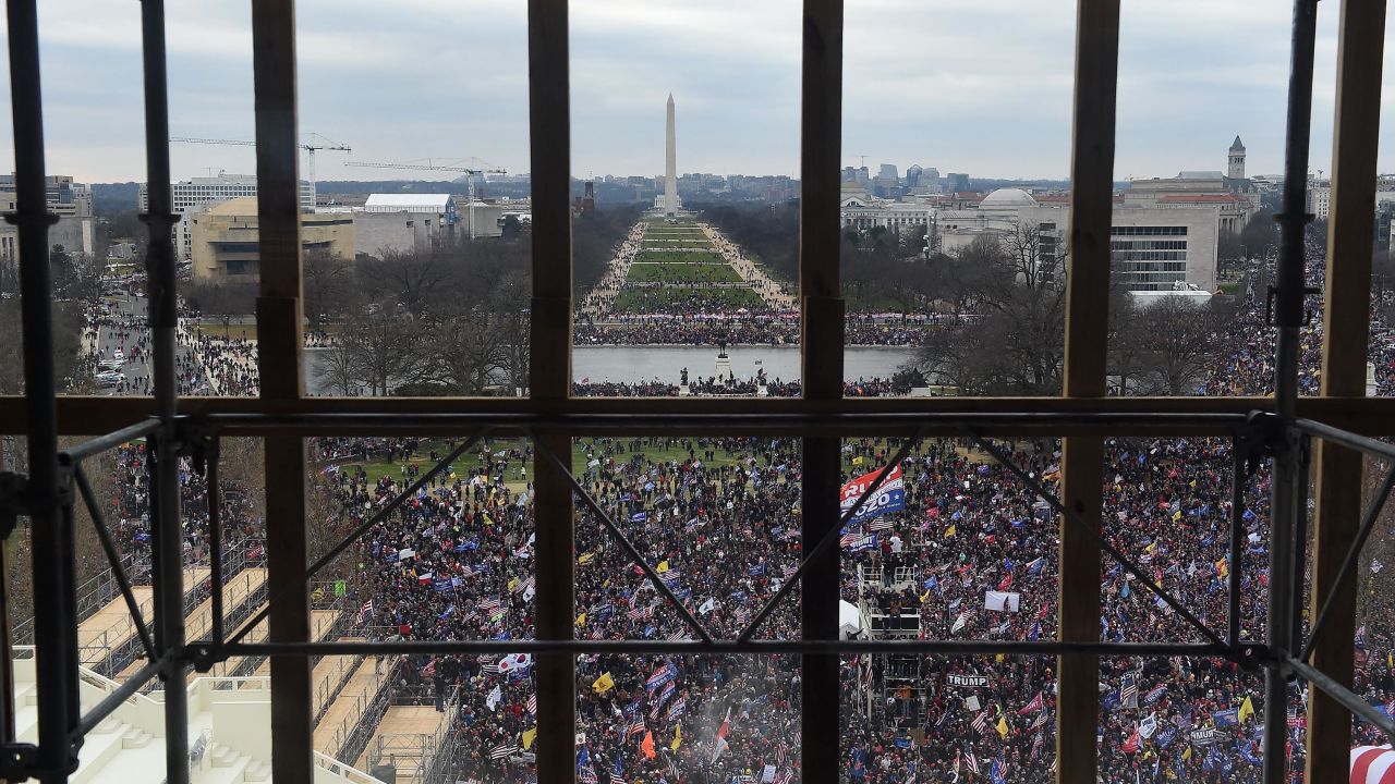 Supporters of US President Donald Trump are seen from behind scaffolding as they gather outside the US Capitol's Rotunda on January 6, 2021, in Washington, DC. 