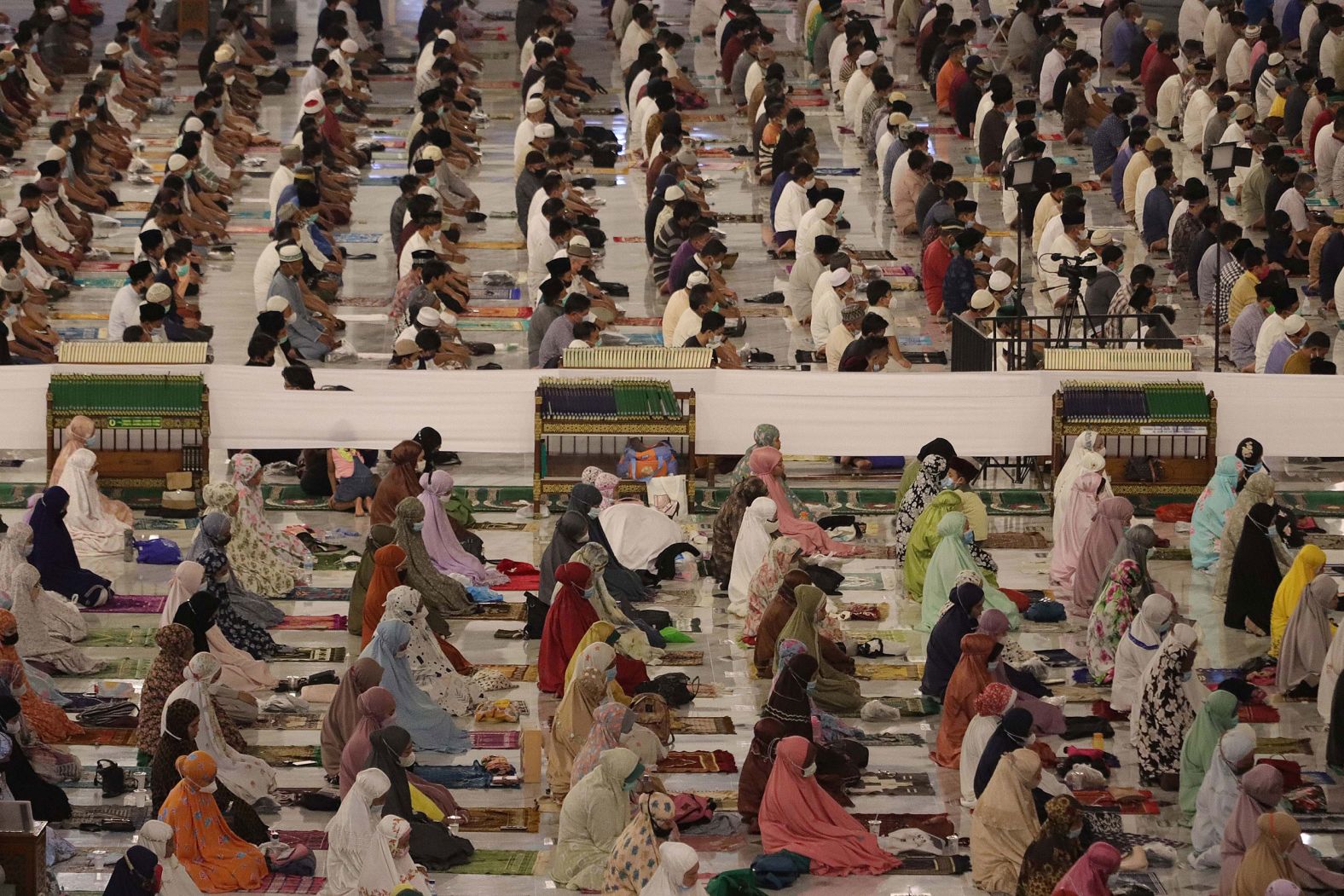 Muslims pray at the Al-Akbar Mosque in Surabaya, Indonesia.