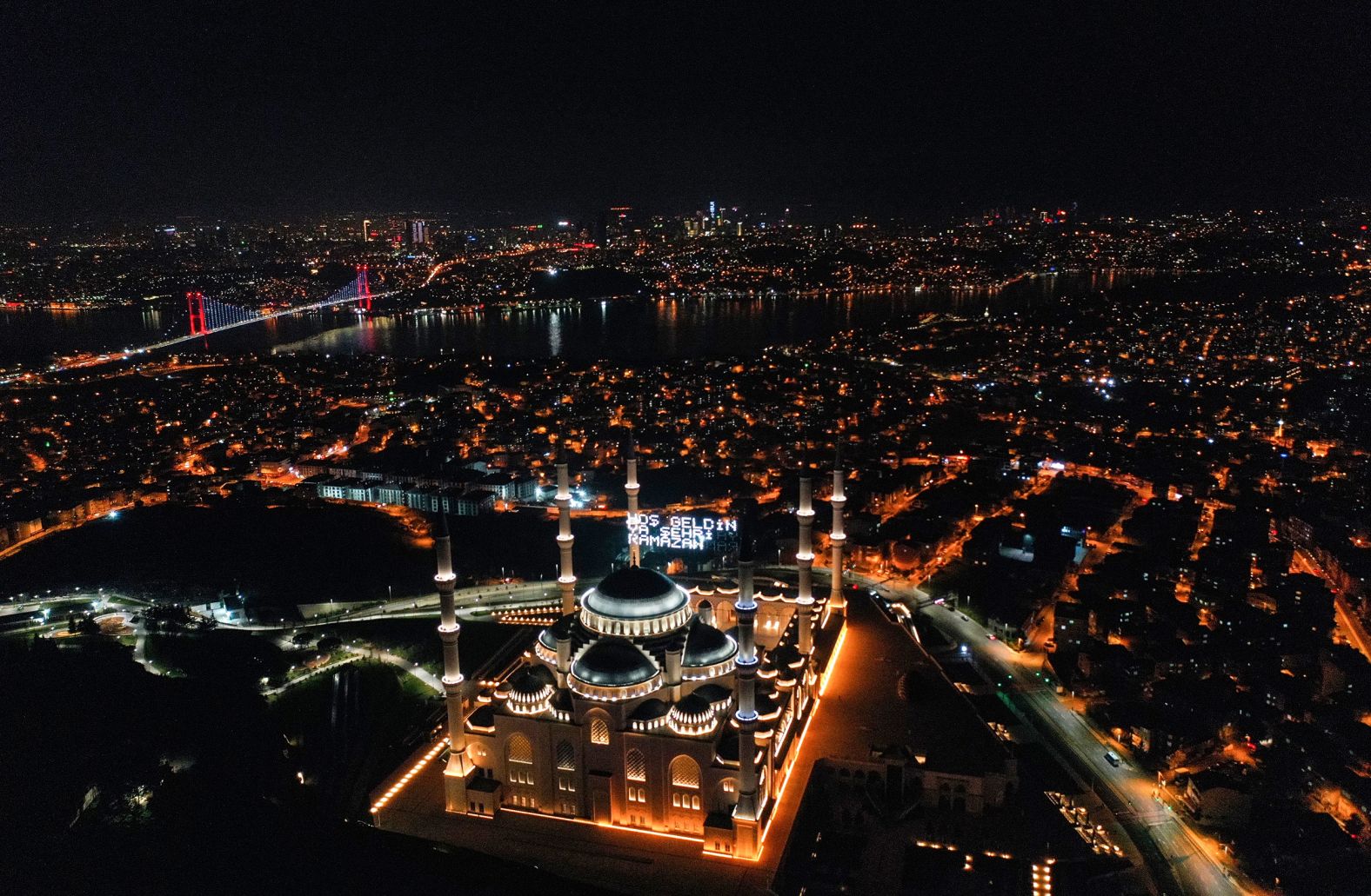 Ramadan messages are illuminated above the Camlica Mosque in Istanbul.