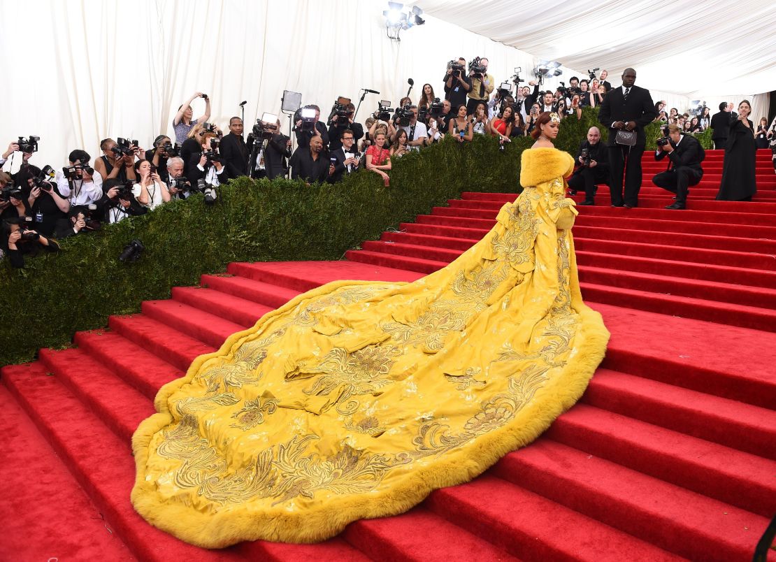 Rihanna floors on-lookers in her trailing canary yellow gown at the 2015 Met Gala.
