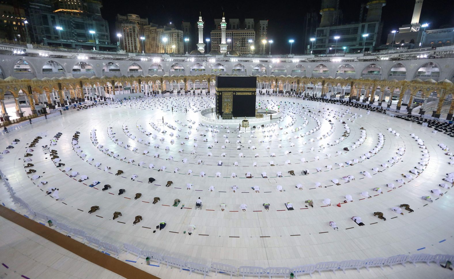 Muslims perform the evening "tarawih" prayer around the Kaaba in Mecca, Saudi Arabia, on April 13. Only people who've been vaccinated or recently recovered from Covid-19 will be allowed to perform prayers at the Grand Mosque.