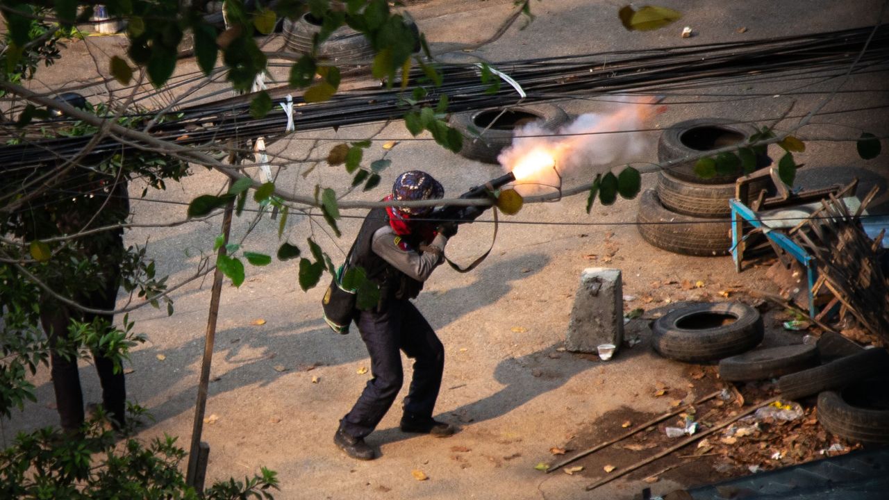 Myanmar police seen shooting a 38 mm grenade launcher at protesters during a demonstration against the military coup.