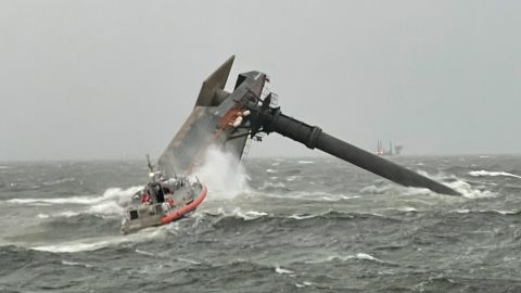 A Coast Guard boats heads toward a capsized commercial liftboat south of Port Fourchon, Louisiana, on Tuesday, April 13.