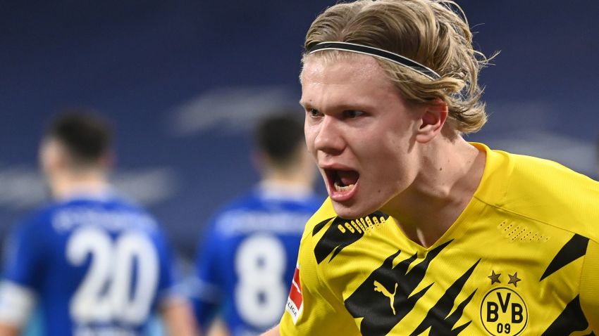 Dortmund's Norwegian forward Erling Braut Haaland celebrates scoring the 4-0 goal during the German first division Bundesliga football match FC Schalke 04 vs Borussia Dortmund in Gelsenkirchen, western Germany, on February 20, 2021. (Photo by Ina Fassbender / various sources / AFP) / RESTRICTIONS: DFL REGULATIONS PROHIBIT ANY USE OF PHOTOGRAPHS AS IMAGE SEQUENCES AND/OR QUASI-VIDEO (Photo by INA FASSBENDER/AFP via Getty Images)