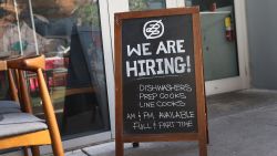 A 'we are hiring sign' in front of the Buya restaurant on March 05, 2021 in Miami, Florida. The restaurant is looking to hire more workers as the U.S. unemployment rate drops to 6.2 percent, as many restaurants and bars reopen. Officials credit the job growth to declining new COVID-19 cases and broadening vaccine immunization that has helped more businesses reopen with greater capacity. (Photo by Joe Raedle/Getty Images)