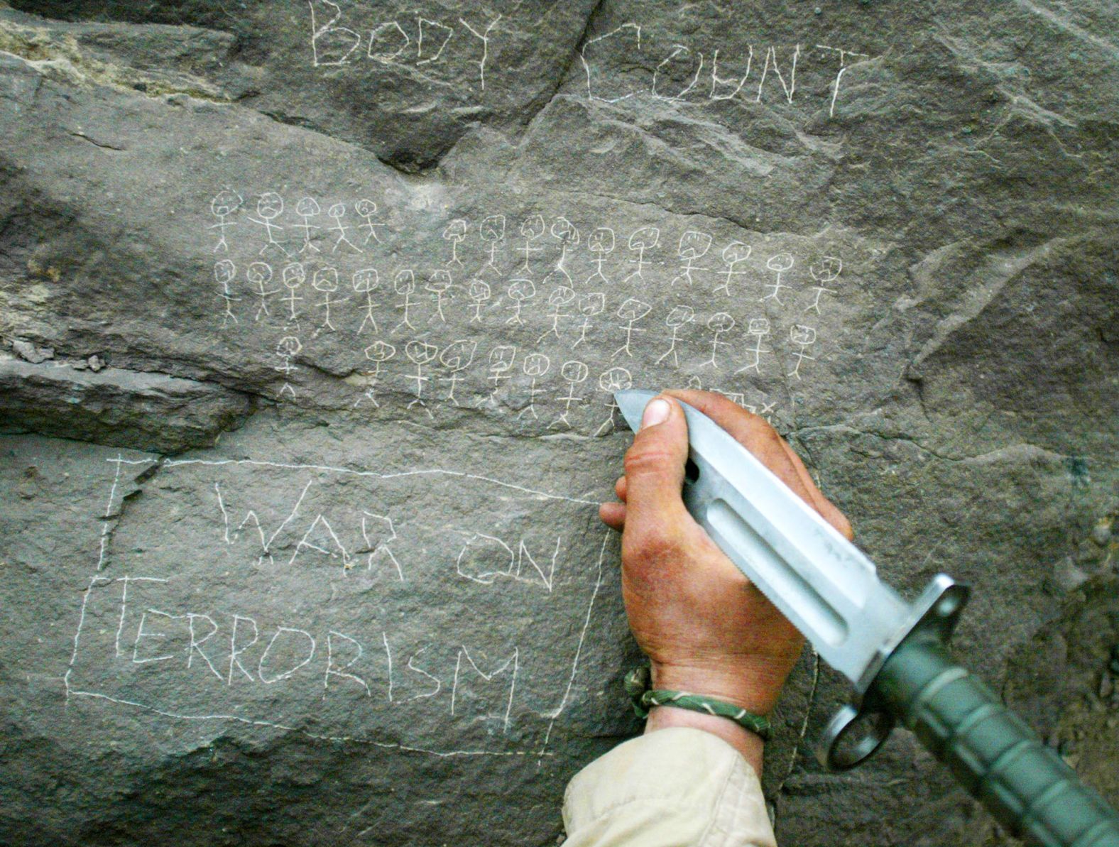 US soldier Jorge Avino tallies the number of people that his mortar team had killed while fighting in Afghanistan in March 2002.