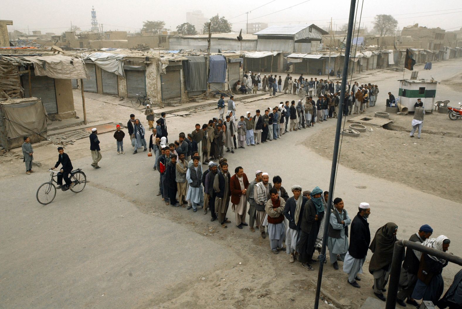 Afghans in Kabul line up to vote in the country's first democratic election in October 2004. Hamid Karzai was sworn in as President in December of that year.