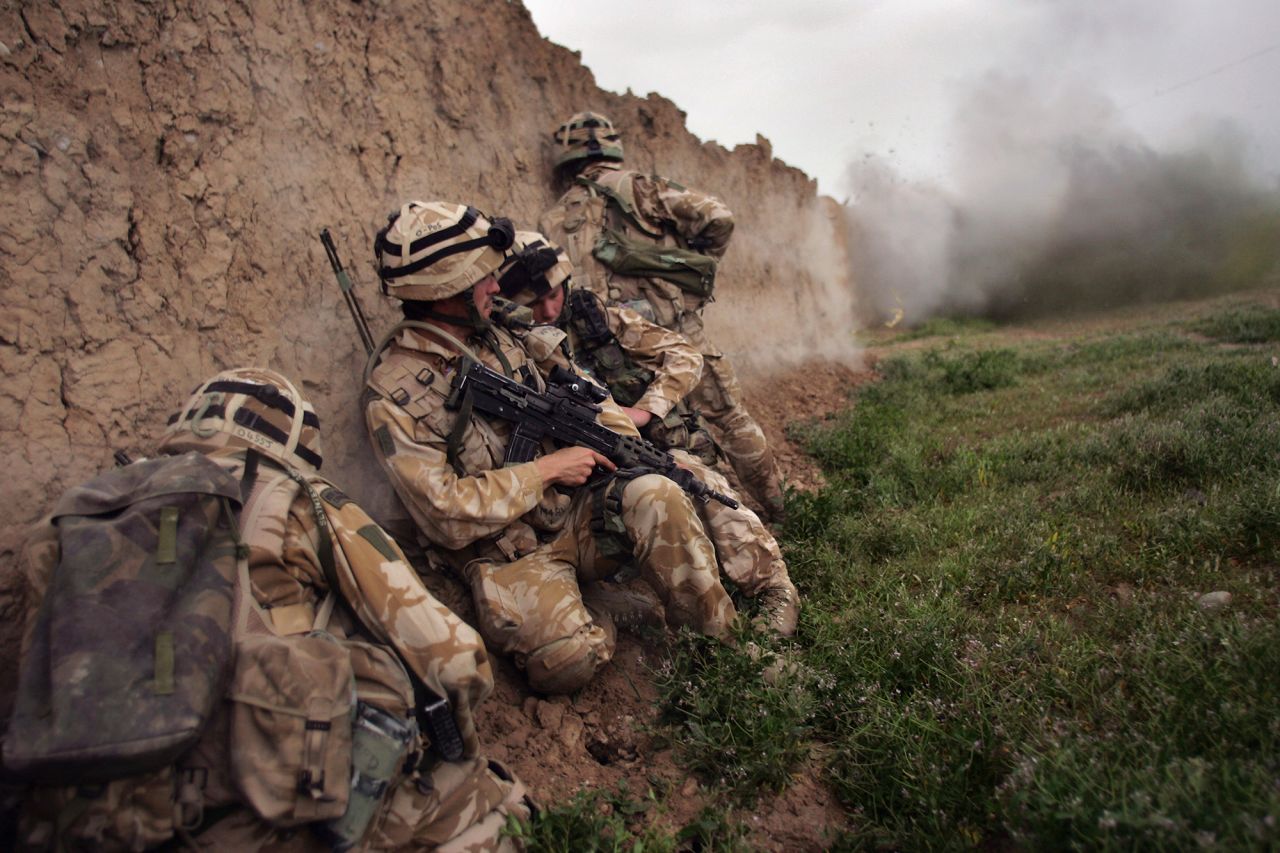 British Marines take cover during an anti-Taliban operation near Kajaki, Afghanistan, in March 2007. Many other countries also deployed troops to the country.