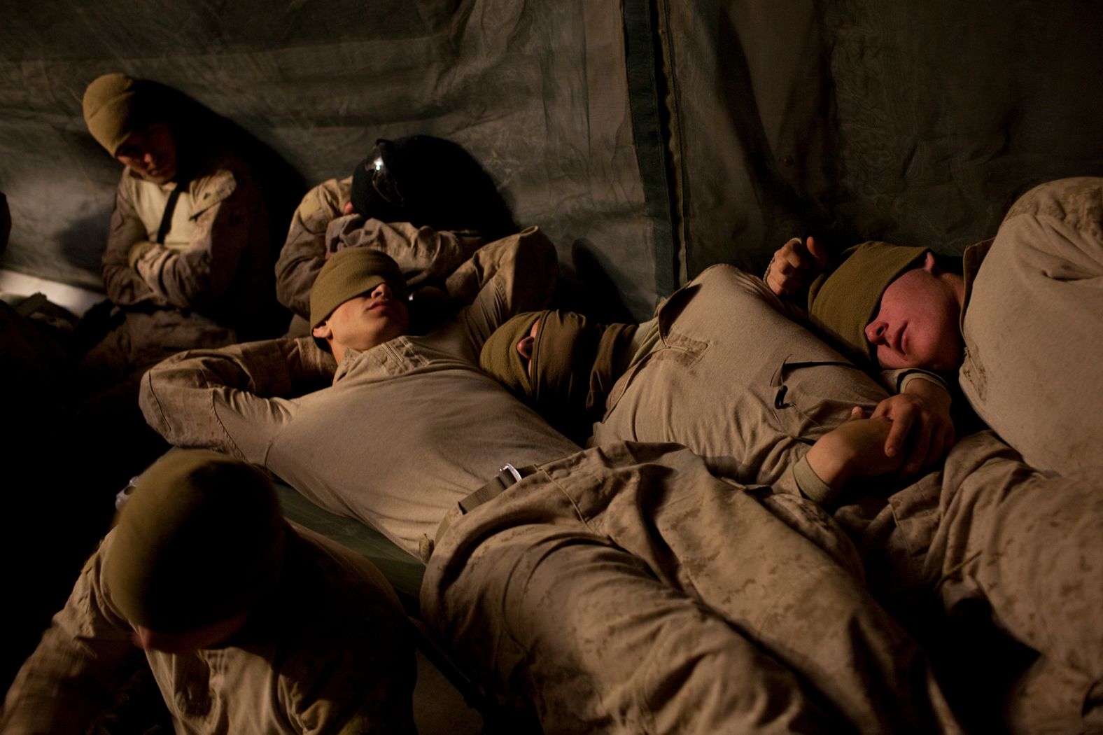 Troops rest at an airfield in Afghanistan's Helmand province in February 2010.
