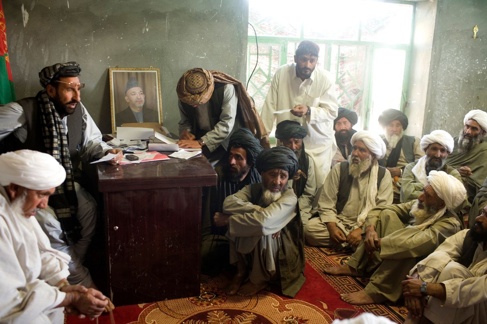 Village elders meet in Marja, Afghanistan, in March 2010.