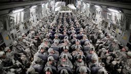 FILE -- American soldiers aboard a C-17 transport headed to Afghanistan, April 5, 2010. The United States and the Taliban are closing in on a deal to end America's longest war after six days of some of the most serious Afghan peace negotiations to date wrapped up on Jan. 26, 2019. (Damon Winter/The New York Times)  