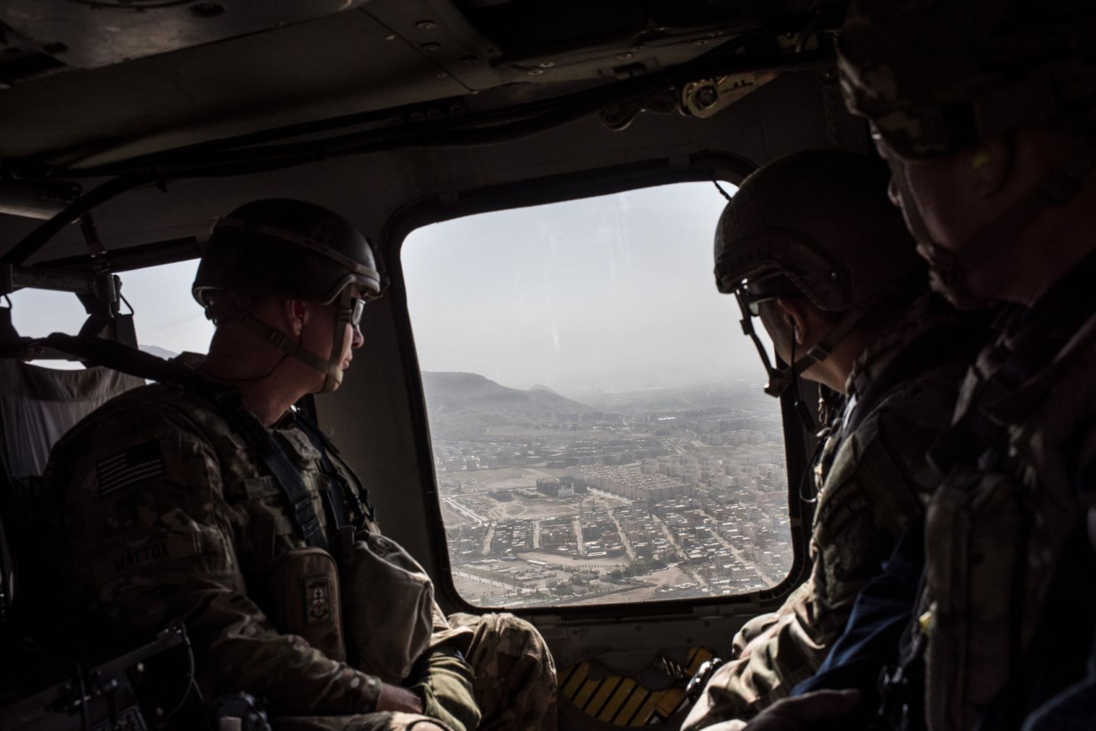 American service members ride in a helicopter on the way to the Bagram Air Base near Kabul in September 2017. President Donald Trump had recently announced a plan to increase troops in the country.